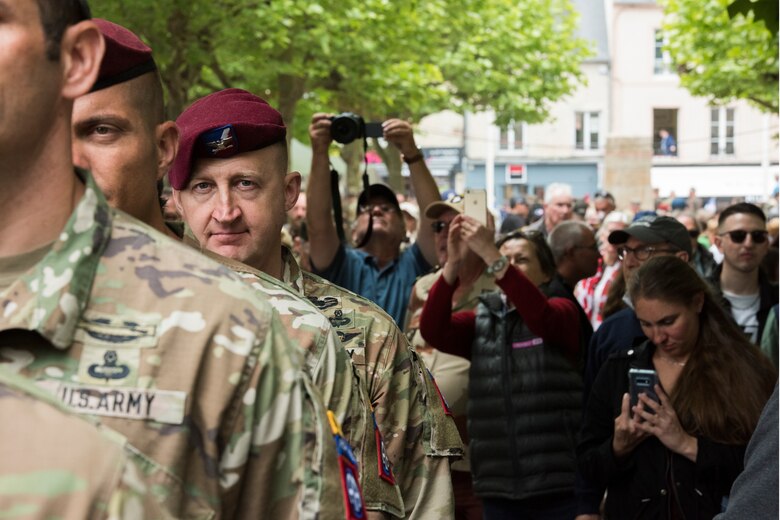 U.S. Army Col. Jon Beale, 82nd Airborne Division Sustainment Brigade commander, stands at attention with fellow airborne infantrymen before filing into the Sainte-Mère-Église Church to honor those that paid the ultimate sacrifice on D-Day, 75 years ago, in Sainte-Mère-Église, France, June 6, 2019. In total, approximately 1,000 U.S. service members participated in the 75th anniversary of D-Day commemorations, which consisted of 55 ceremonies and events across 40 French communities in the region of Normandy, France. (U.S. Air Force photo by Senior Airman Kristof J. Rixmann)
