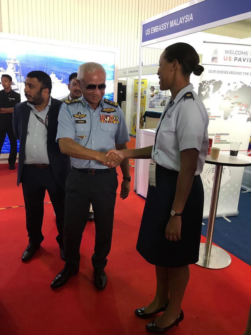 Maj. Chyteira Dues, Washington National Guard Malaysian Bilateral Affairs Officer, greets Gen.Tan Sri Dato’ Sri Hj Affendi bin Buang, the Royal Malaysian Air Force Chief, during the Langkawi International Maritime and Aerospace Exhibition in Malaysia March 2019.