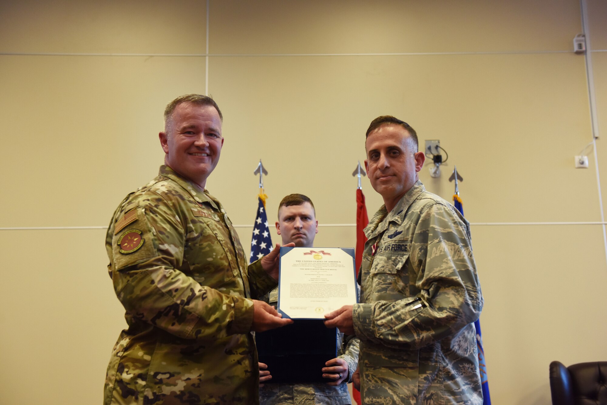 Col. Paul R. Quigley, 39th Weapons System Security Group commander, left, presents the Meritorious Service Medal to Lt. Col. John A. Talafuse, outgoing 39th Operations Support Squadron commander, during a change of command ceremony June 6, 2019, on Incirlik Air Base, Turkey. During his time as commander, Talafuse oversaw 80,000 operations at the U.S. Air Force’s busiest air traffic control complex in Europe. (U.S. Air Force photo by Senior Airman Joshua Magbanua)