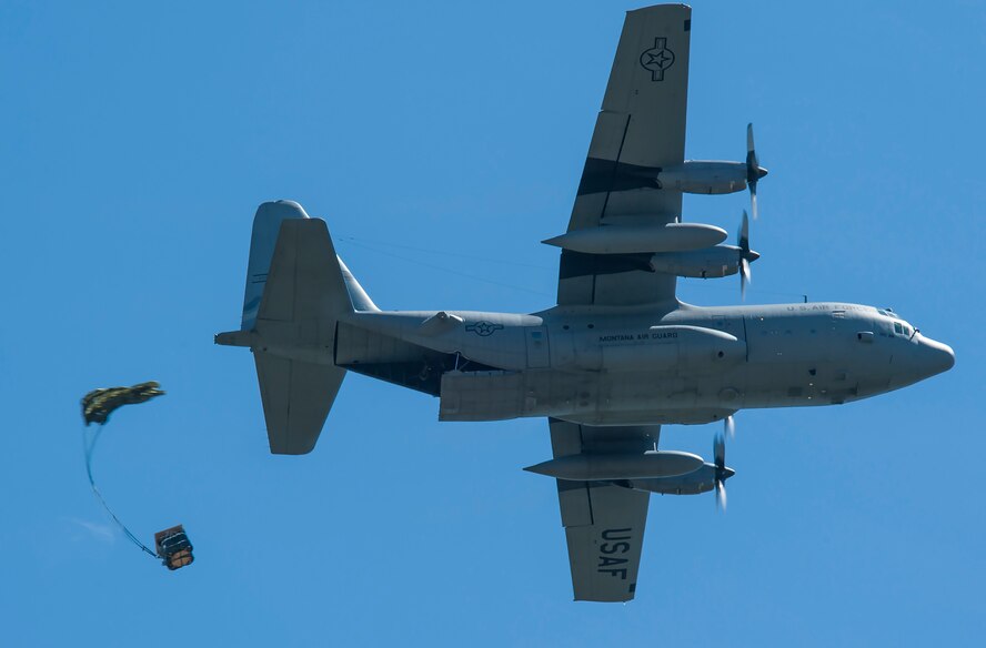 A C-130 drops a Container Delivery System bundle
