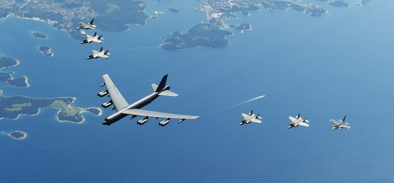 U.S. and Italian Air Forces aircraft fly in formation