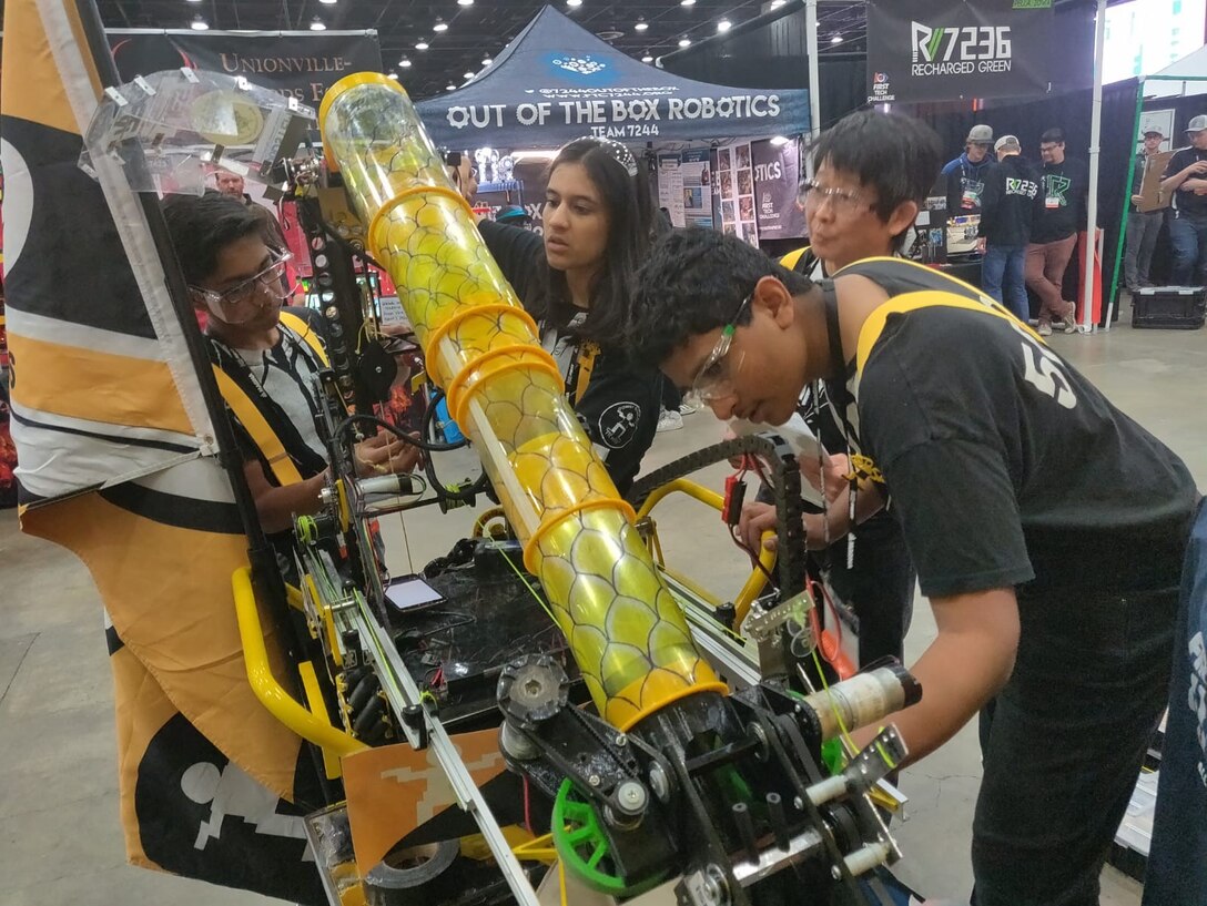 The FIRST Championship was held in Detroit, Michigan, April 24-27, and Team 5029, the Powerstackers, coached by William Pickl, an engineering branch chief, Air Force Life Cycle Management Center, Business Systems Division and his wife, Teri, competed against 159 teams from around the world, taking second place. Left to right: Neev Gupta, 14, Laksmi Avanthsa, 14, Terence Chu, head coach, and Krishna Suresh, 16. (Courtesy photo)