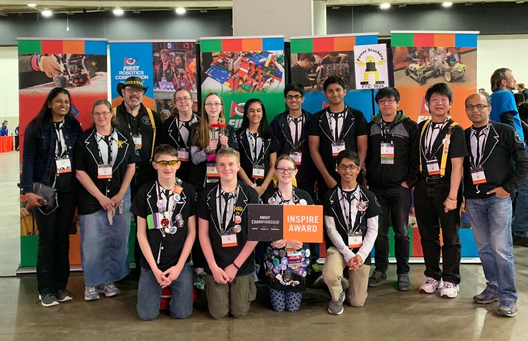 The FIRST Championship was held in Detroit, Michigan, April 24-27, and Team 5029, the Powerstackers, coached by William Pickl, an engineering branch chief, Air Force Life Cycle Management Center, Business Systems Division and his wife, Teri, competed against 159 teams from around the world, taking second place. Back row: Subha Ambigapathy, coach, Michelle Flannery, mentor, William Pickl, coach, Teri Pickl, coach, Corinne Pickl, 13, Lakshmi Avanthsa, 14, Vishnu Avanthsa, 16, Krishna Suresh, 16, Justin, Chu, 23, Terence Chu, head coach, Vipin Gupta, mentor. Front row: RJ Sells, 16, Joshua Flannery, 14, Cailey Pickl, 12, Neev Gupta, 14. (Courtesy photo)