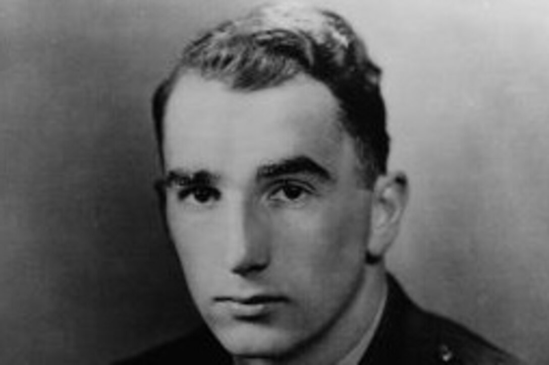 A black and white photograph of a Navy officer.