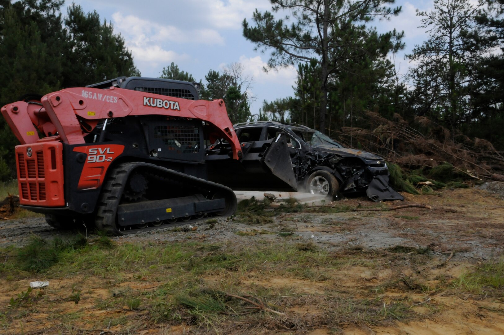 Civil engineer team members participate in a route clearing exercise simulating an after effect of a tornado during Exercise Global Dragon 2019 at the Guardian Centers of Georgia, held in Perry, Ga., May 29, 2019. Global Dragon is a biannual, Air National Guard led joint training exercise focusing on career fields across the Mission Support enterprise in as close to real-world conditions as possible.