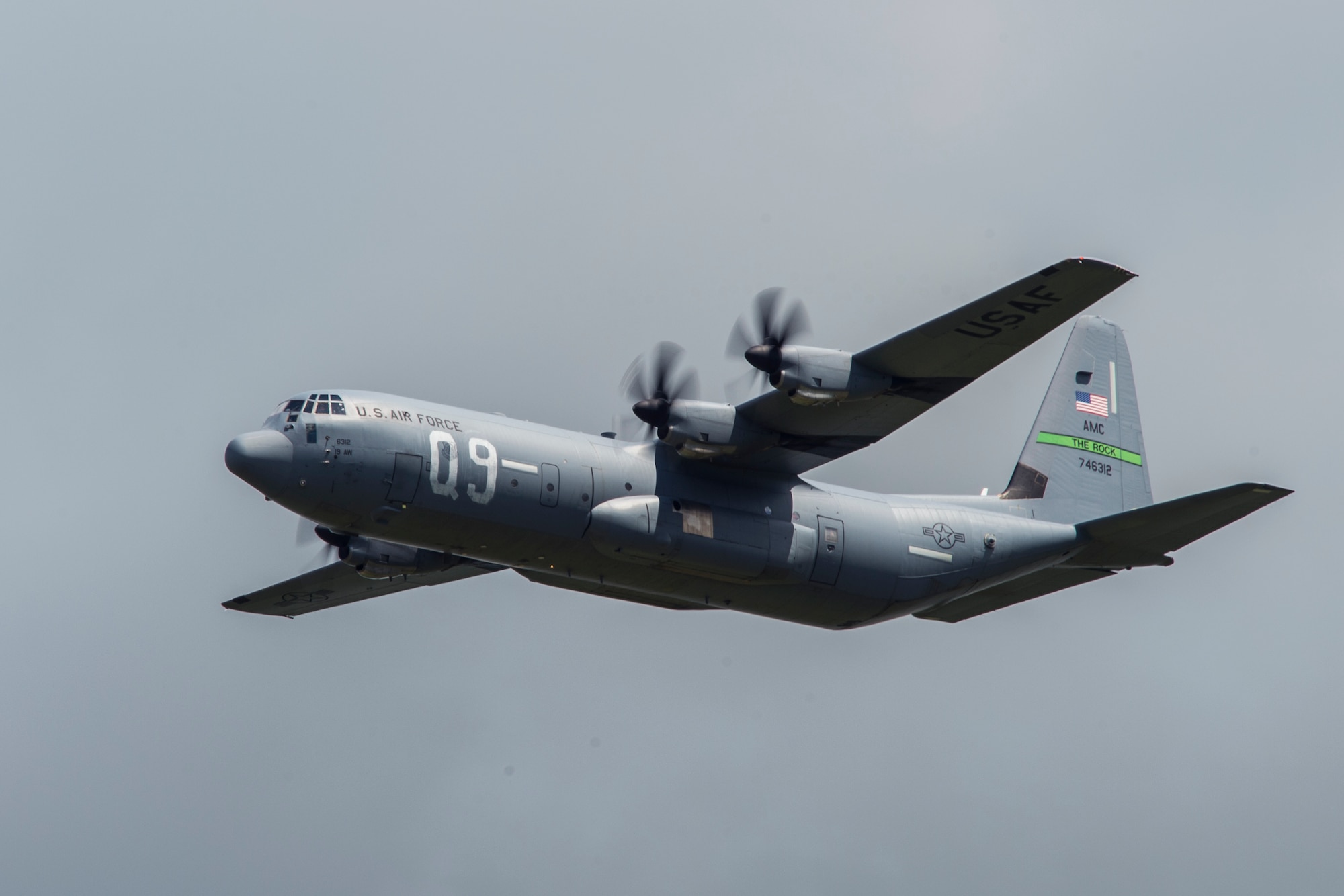 A U.S. Air Force C-130J Super Hercules, assigned to the 61st Airlift Squadron, Little Rock Air Force Base, Ark., flies over Cherbourg-Maupertus Airport, France, June 6, 2019. The 61st AS’ lineage stems from the 61st Troop Carrier Squadron, who wore the “Q9” identifier during the airdrops conducted over Normandy during Operation Neptune June 6, 1944. (U.S. Air Force photo by Senior Airman Devin M. Rumbaugh)