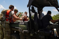Soldiers unload Gator utility vehicle