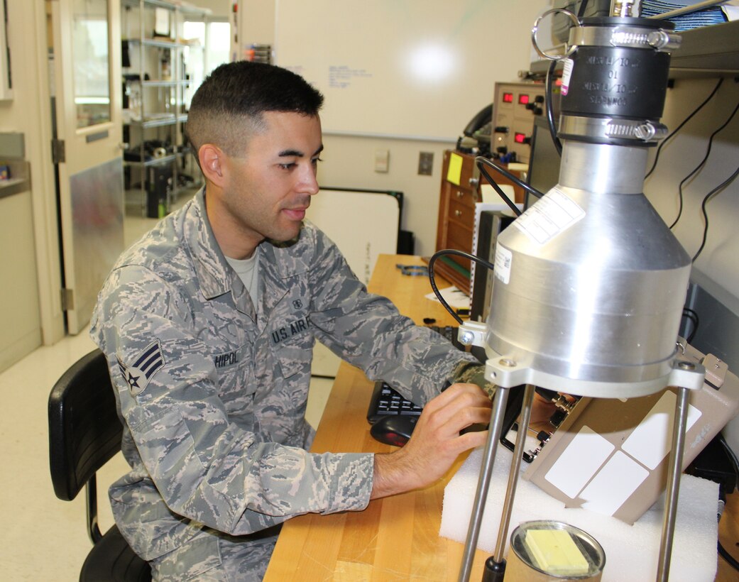Staff Sgt. Kyle Hipol, 711th Human Performance Wing Defense Occupational and Environmental Health Readiness System support office consultant, calibrates a piece of radiac equipment used by the Air Force radiation assessment team. Hipol applied the Comprehensive Fitness training he received and incorporated physical fitness as an outlet to overcome adversity. Hipol took up running and is now registered to run the Air Force Marathon on Sept 21.  (U.S. Air Force photo/Stacey Geiger)
