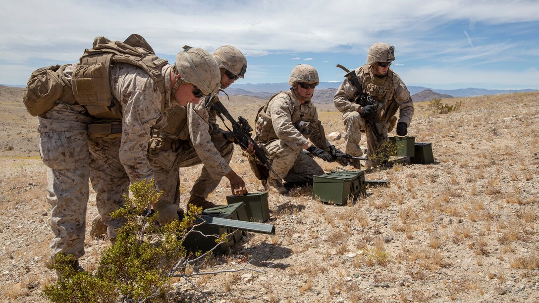 U.S. Marines with 1st Battalion, 5th Marine Regiment, 1st Marine Division, set up their ammunition during an integrated training exercise at Marine Corps Air Ground Combat Center, Twentynine Palms, California, April 28, 2019.