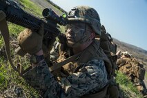 U.S. Marine Corps Lance Cpl. Angel Martinez, a rifleman with 2nd Battalion, 1st Marine Regiment, 1st Marine Division, posts security during an Air Raid Course at Marine Corps Base Camp Pendleton, California, Dec. 11, 2018.
