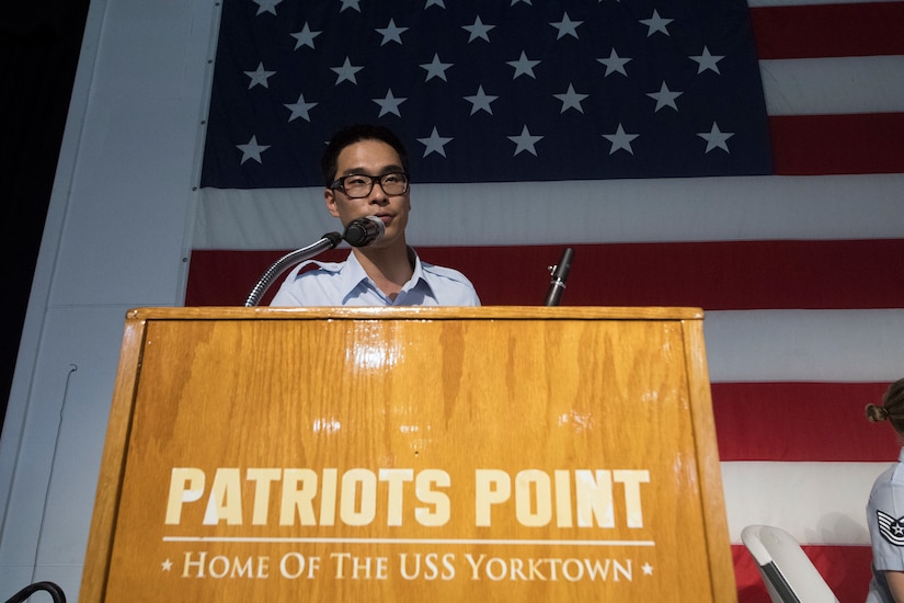 Airman 1st Class Louis Kim, a clarinet player with the U.S. Air Force Heritage Winds, introduces himself to the crowd during a performance June 6th, 2019, in Mount Pleasant, S.C.