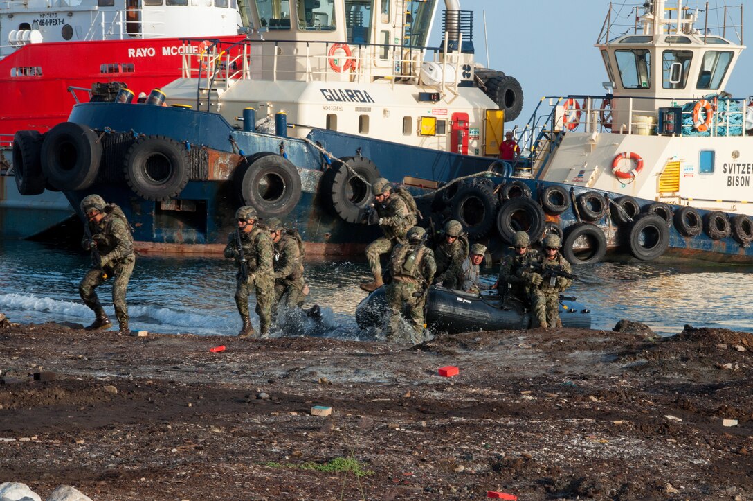 Mexican Navy personnel arrive by boat during the final exercise scenario for the first phase of Exercise Tradewinds 19.