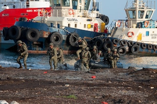 Mexican Navy personnel arrive by boat during the final exercise scenario for the first phase of Exercise Tradewinds 19.