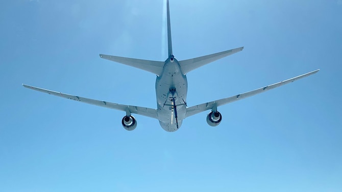 A KC-46A Pegasus assigned to McConnell flys above a 931st Air Refueling Wing KC-135 Stratotanker aircrew after being evacuated May 9, 2019, McConnell Air Force Base, Kan.  Team McConnell aircrews stayed one step ahead of the inclement weather this season and evacuated a total of 8 KC-135 Stratotankers and 3 KC-46 Pegasuses in less than six hours early last month.