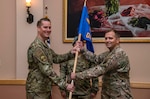 U.S Air Force Lt. Col. Andrew P. Berven, 66th Training Squadron commander, passes the guidon to Maj. Toby A. Andrews, assuming command, during the 66th TRS, Detachment 3, change of command ceremony June 7, 2019, at Joint Base San Antonio-Lackland, Texas. The 66th TRS, Detachment 3, is responsible for providing environmentally specific trained and globally qualified Airmen in Survival, Evasion, Resistance and Escape (SERE) courses.  The detachment selects and trains over 6,000 pipeline technical training Airmen a year in the proper use of principles, techniques, equipment, and procedures necessary to survive anywhere in the world. (U.S. Air Force photo/Johnny Saldivar)