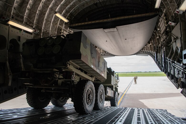 Oklahoma Army National Guard Soldiers and members from the 58th Air Refueling Squadron load a High-Mobility Artillery Rocket Systems (HIMARS) into a C-17 Globemaster III as part of a training exercise, June 3, 2019, at Altus Air Force Base, Okla. Other military branches, such as the Army National Guard, are an invaluable asset to aircrew training, helping to integrate what they learn from the exercise into future operations. (U.S. Air Force photo by Airman 1st Class Breanna Klemm)