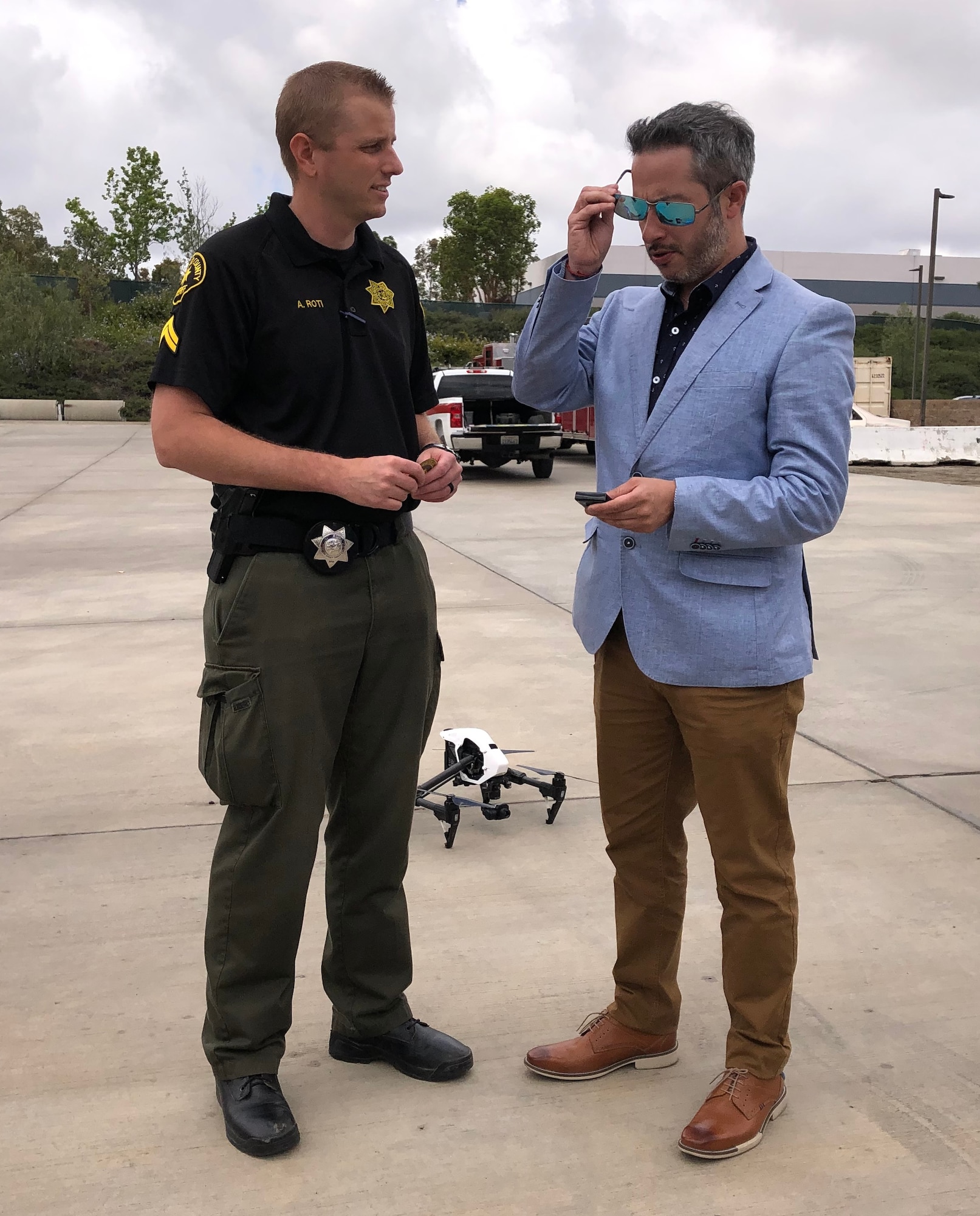 San Diego Sheriff Department Deputy Alex Roti and Comisario Gerardo Andres Valenzuela, Policia de Investigaciones (PDI) Santiago, Chile, flank a drone during the first Unmanned Aerial Systems Seminar in California hosted by AFOSI FPD, Chile, May 20-24, 2019. (Photo submitted by SA Carlos Vargas, FPD, Chile)