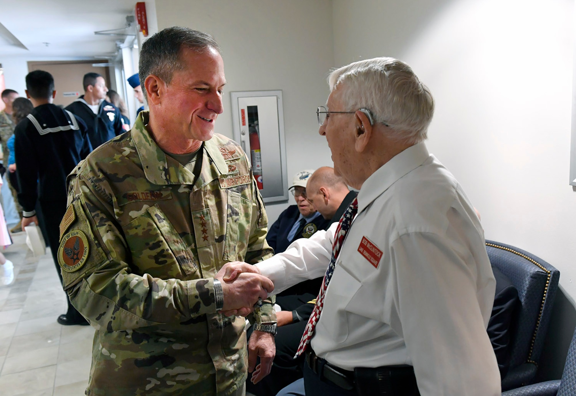 U.S. Air Force Gen. David Goldfein, Chief of Staff of the Air Force, greets 1st Lt. Bob McClintock, a World War II veteran, at a commemoration of the 75th anniversary of the D-Day invasion at MacDill Air Force Base, Fla., June 6, 2019.