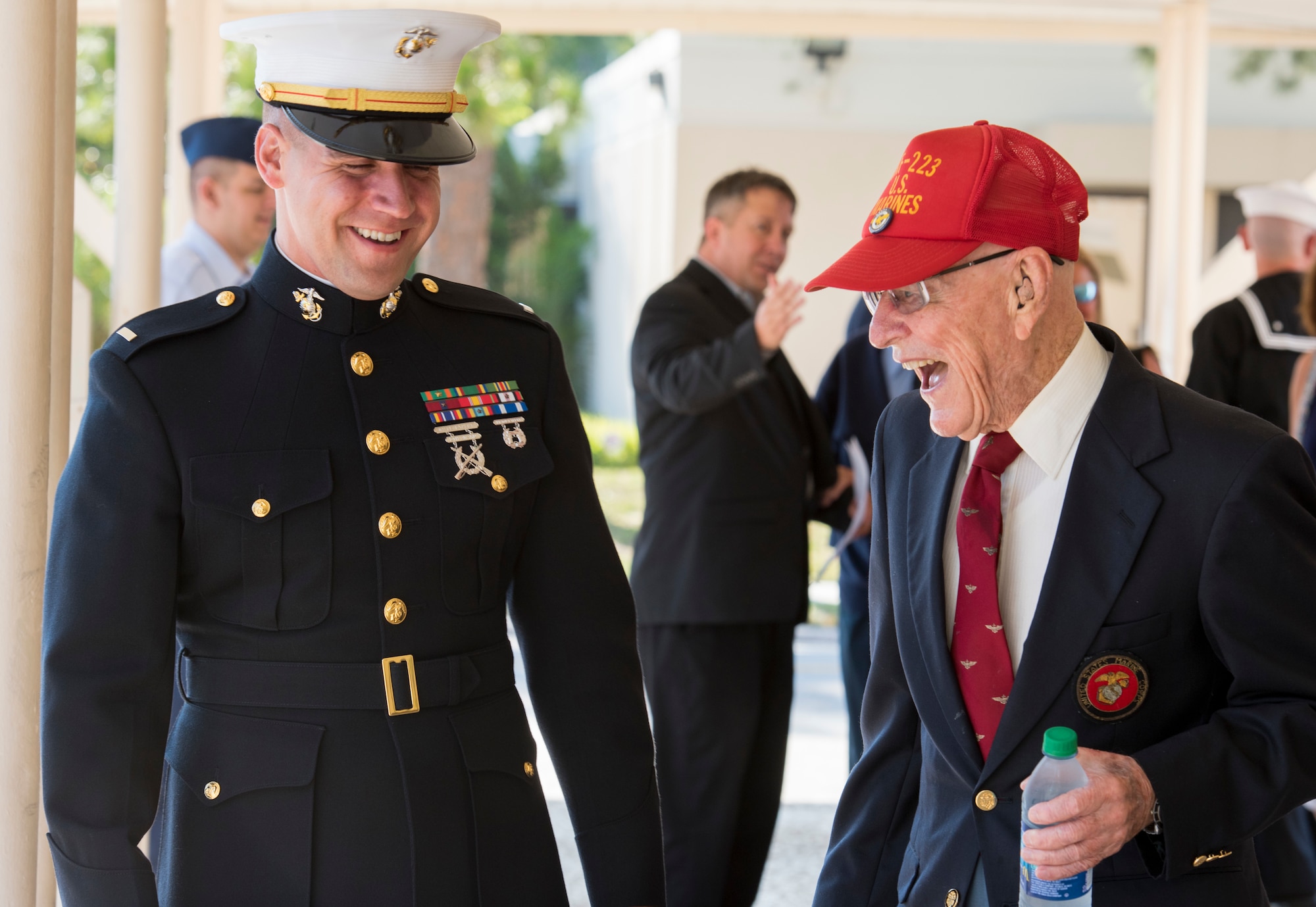 A U.S. Marine laughs with a World War II Marine Corps veteran before the 75th D-Day Commemoration at MacDill Air Force Base, Fla., June 6, 2019.