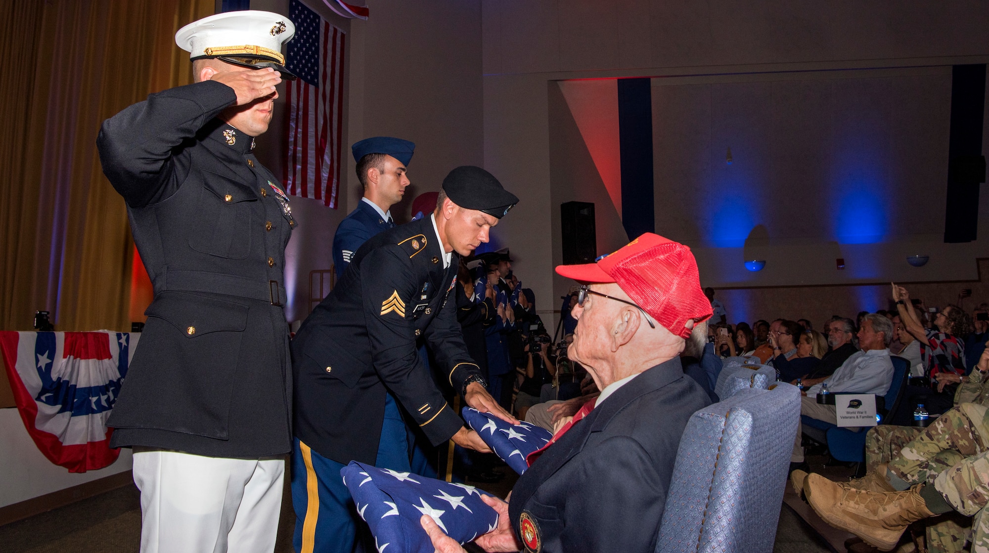 MacDill’s joint service members present a flag during the 75th D-Day Commemoration to each World War II veteran in attendance at MacDill Air Force Base, Fla., June 6, 2019.
