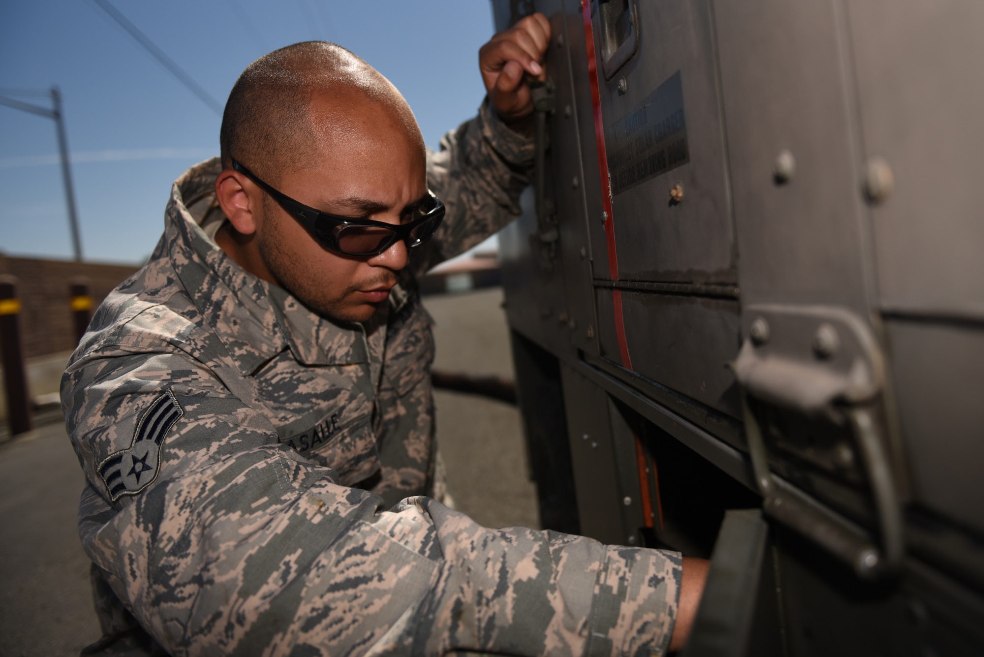 U.S. Air Force Senior Airman Ayreial Lasalle, 60th Maintenance Squadron aerospace ground equipment journeyman, removes damaged parts from inside a generator June 5, 2019, at Travis Air Force Base, California. The AGE flight ensures other maintenance teams have the equipment they need to launch aircraft on time. (U.S. Air Force photo by Airman 1st Class Cameron Otte)