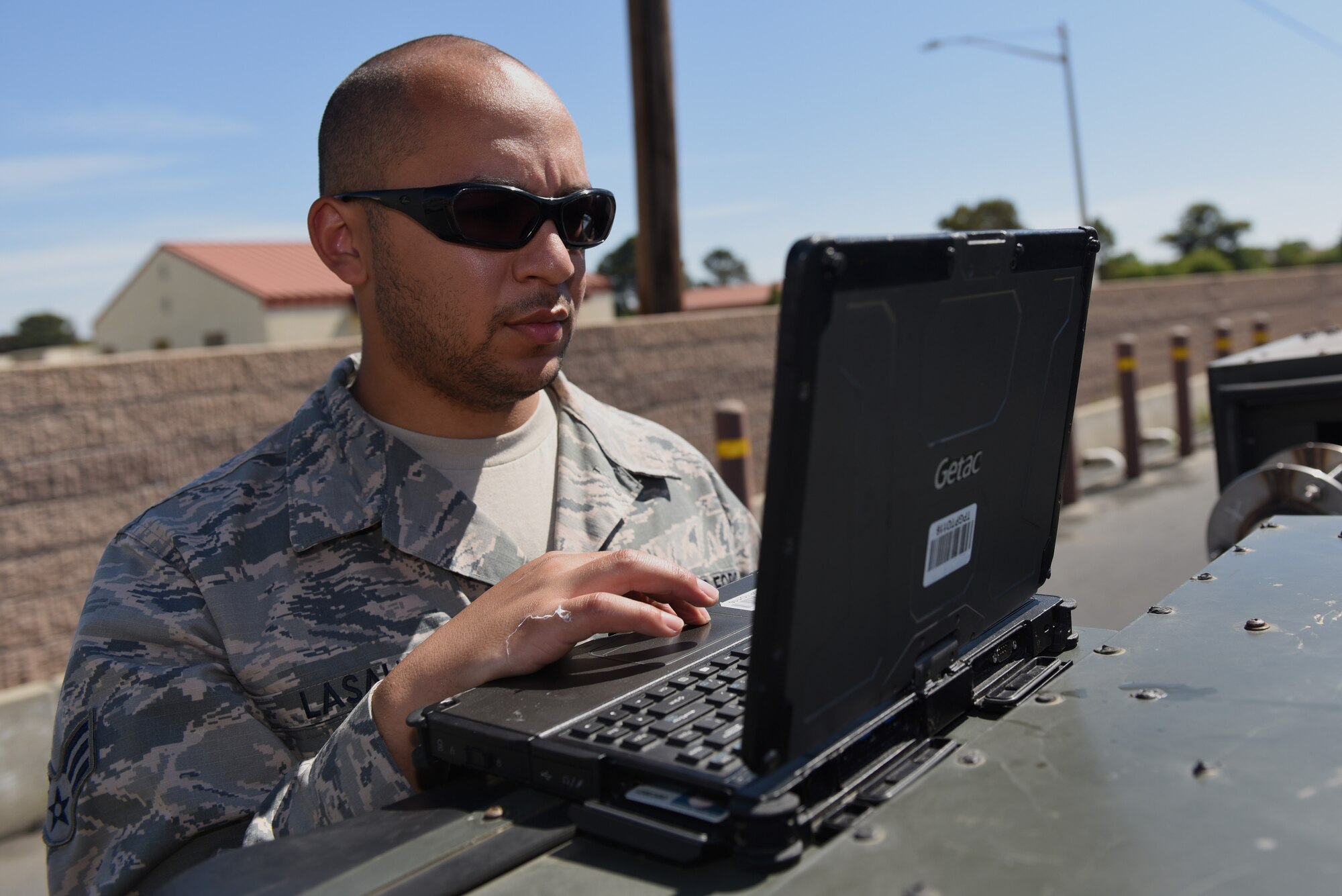 U.S. Air Force Senior Airman Ayreial Lasalle, 60th Maintenance Squadron aerospace ground equipment journeyman, checks his computer for parts needed to maintain a generator June 5, 2019, at Travis Air Force Base, California. The AGE flight ensures other maintenance teams have the equipment they need to launch aircraft on time. (U.S. Air Force photo by Airman 1st Class Cameron Otte)