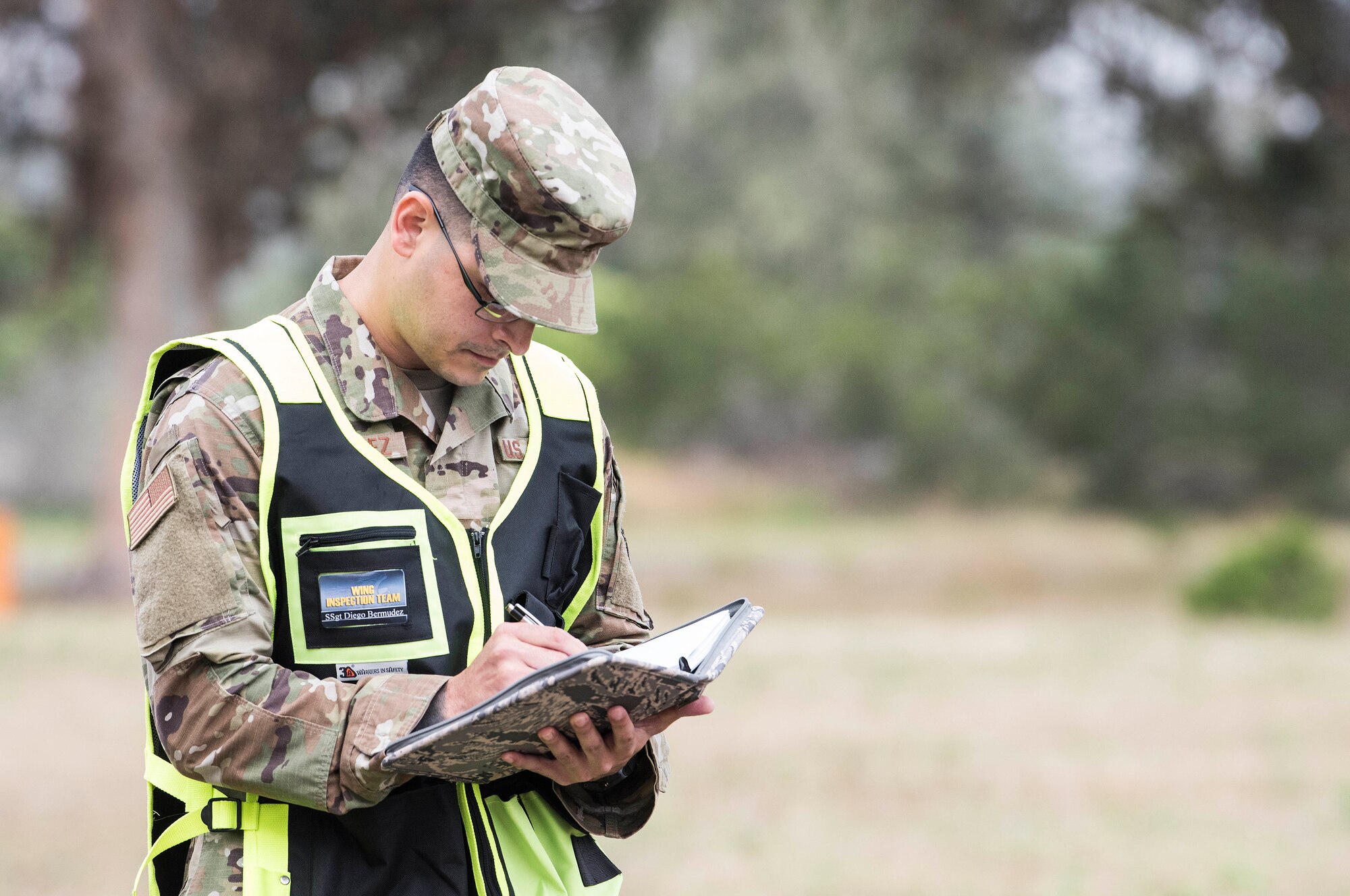 Staff Sgt. Diego Bermudez, 30th Space Wing Inspector General team member and judge advocate NCO in charge of military justice, takes notes during an earthquake exercise June 5, 2019, at Vandenberg Air Force Base, Calif. During exercises, 30th IG inspection teams ensure units follow proper protocol, as well as provide feedback to the commander on how processes can be improved. (U.S. Air Force photo by Airman 1st Class Hanah Abercrombie)