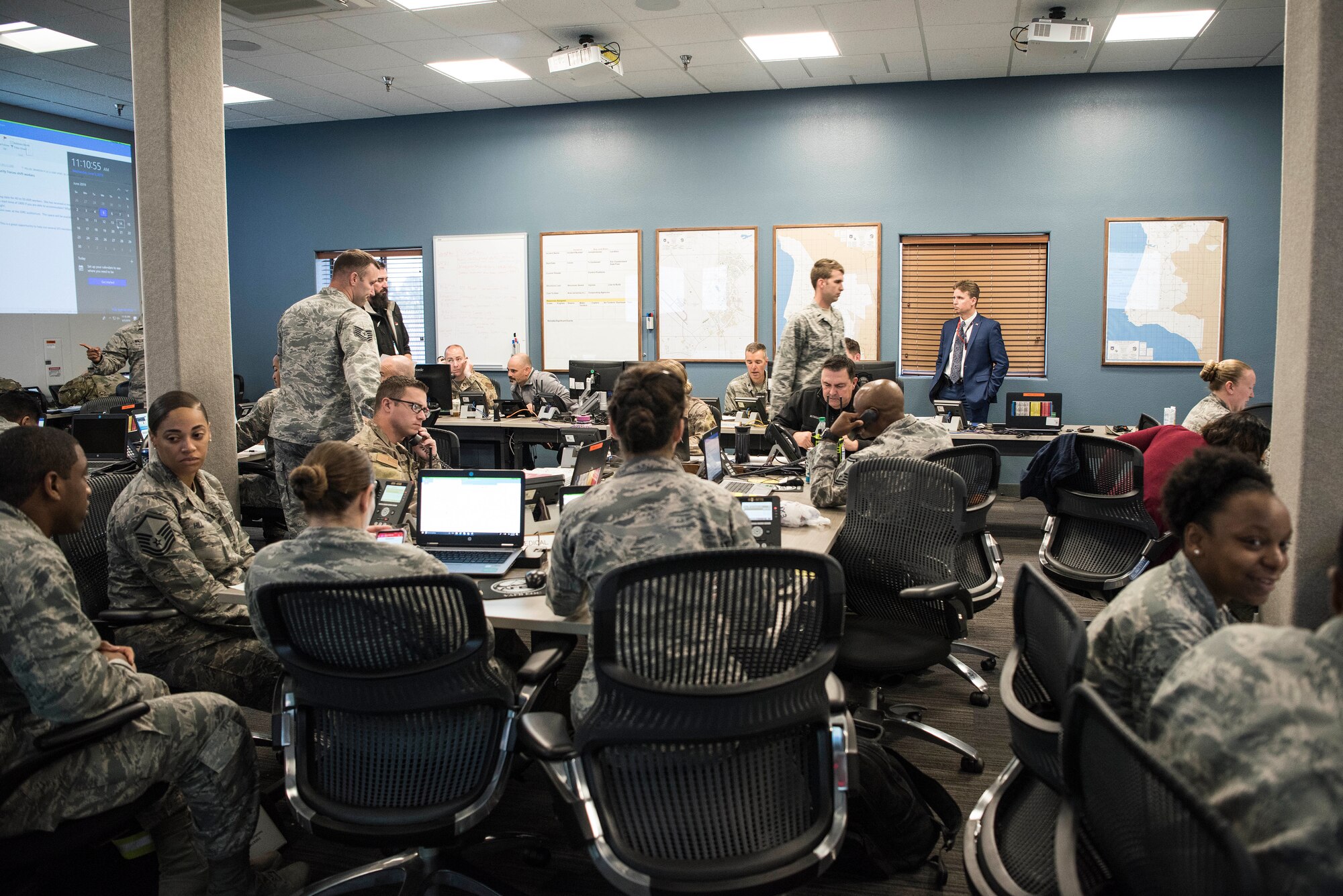 30th Space Wing members in the Emergency Operations Center work together during an earthquake exercise June 5, 2019, at Vandenberg Air Force Base, Calif. Exercises are performed throughout each year to test the base’s readiness and ability to respond to mission crisis, natural disaster and other urgent situations. (U.S. Air Force photo by Airman 1st Class Hanah Abercrombie)