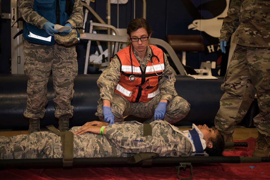 Members from the 30th Medical Group evaluate mock patients during an earthquake exercise June 5, 2019, at Vandenberg Air Force Base, Calif. During the exercise, the 30th MDG had to relocate and set up an alternate treatment facility and were evaluated on their abilities follow proper protocol when switching locations and to treat patients. (U.S. Air Force photo by Airman 1st Class Hanah Abercrombie)