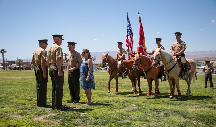 U.S. Marine Corps Col. Kenneth R. Kassner, director, Tactical Training Exercise Control Group, Marine Air Ground Task Force Training Command, receives awards with his wife by his side at Marine Corps Air Ground Combat Center, Twentynine Palms, Calif., May 31, 2019. Kassner retired after 28 years of service in the Marine Corps (U.S. Marine Corps photo by Lance Cpl. Christy Yost)