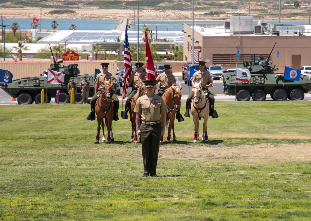 U.S. Marines with the Mounted Color Guard sit at attention on their horses during a retirement ceremony for Col. Kenneth R. Kassner, director, Tactical Training Exercise Control Group, Marine Air Ground Task Force Training Command, at Marine Corps Air Ground Combat Center, Twentynine Palms, Calif., May 31, 2019. Kassner retired after 28 years of service in the Marine Corps (U.S. Marine Corps photo by Lance Cpl. Christy Yost)