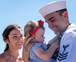 JOINT BASE PEARL HARBOR-HICKAM, Hawaii (June 6, 2019) – A Sailor assigned to the Virginia-class fast attack submarine USS Hawaii (SSN 776) greets his loved ones after arriving at Joint Base Pearl Harbor-Hickam, after completing his latest deployment, June 6. (U.S. Navy Photo by Mass Communication Specialist 1st Class Daniel Hinton)