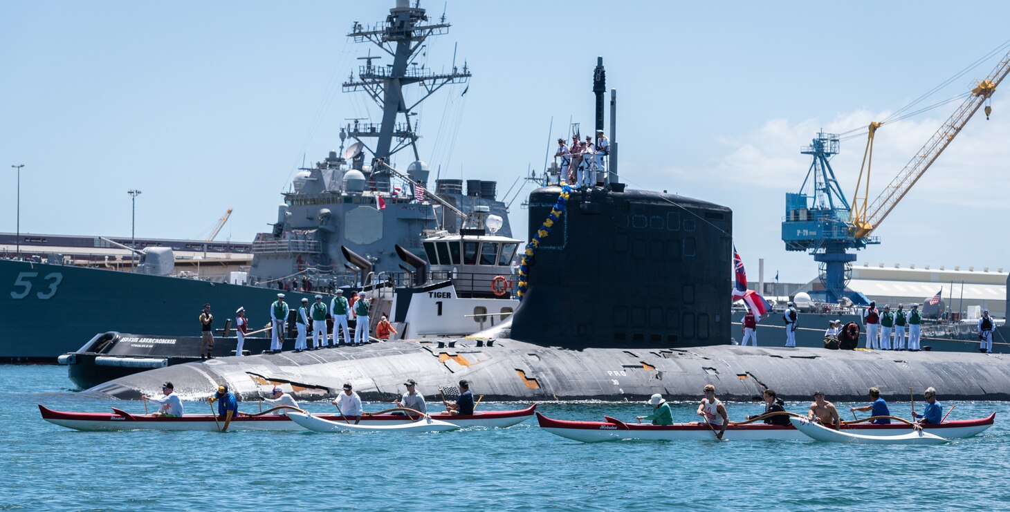 JOINT BASE PEARL HARBOR-HICKAM, Hawaii (June 6, 2019) – Members of the Outrigger Canoe Club escort the Virginia-class fast attack submarine USS Hawaii (SSN 776) as it arrives at Joint Base Pearl Harbor-Hickam, after completing its latest deployment, June 6. (U.S. Navy Photo by Mass Communication Specialist 1st Class Daniel Hinton)