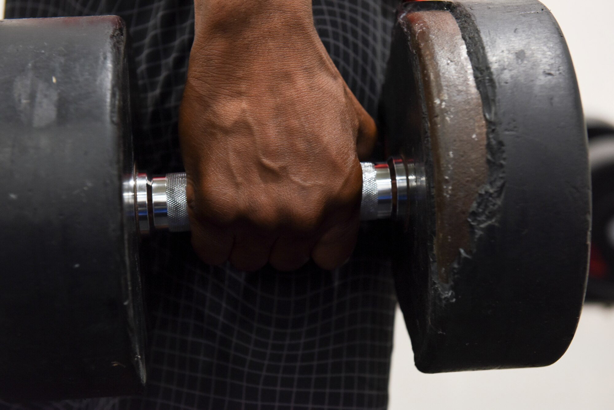 Staff Sgt. Ted Grigsby, 39th Logistics Readiness Squadron fuels facilities supervisor, performs weighted shrugs at the Larger than Life Fitness Center June 5, at Incirlik Air Base, Turkey. The 24-hour fitness center gives Airmen to opportunity to lead a healthy and lean fighting force. (U.S. Air Force photo By Staff Sgt. Matthew J. Wisher)