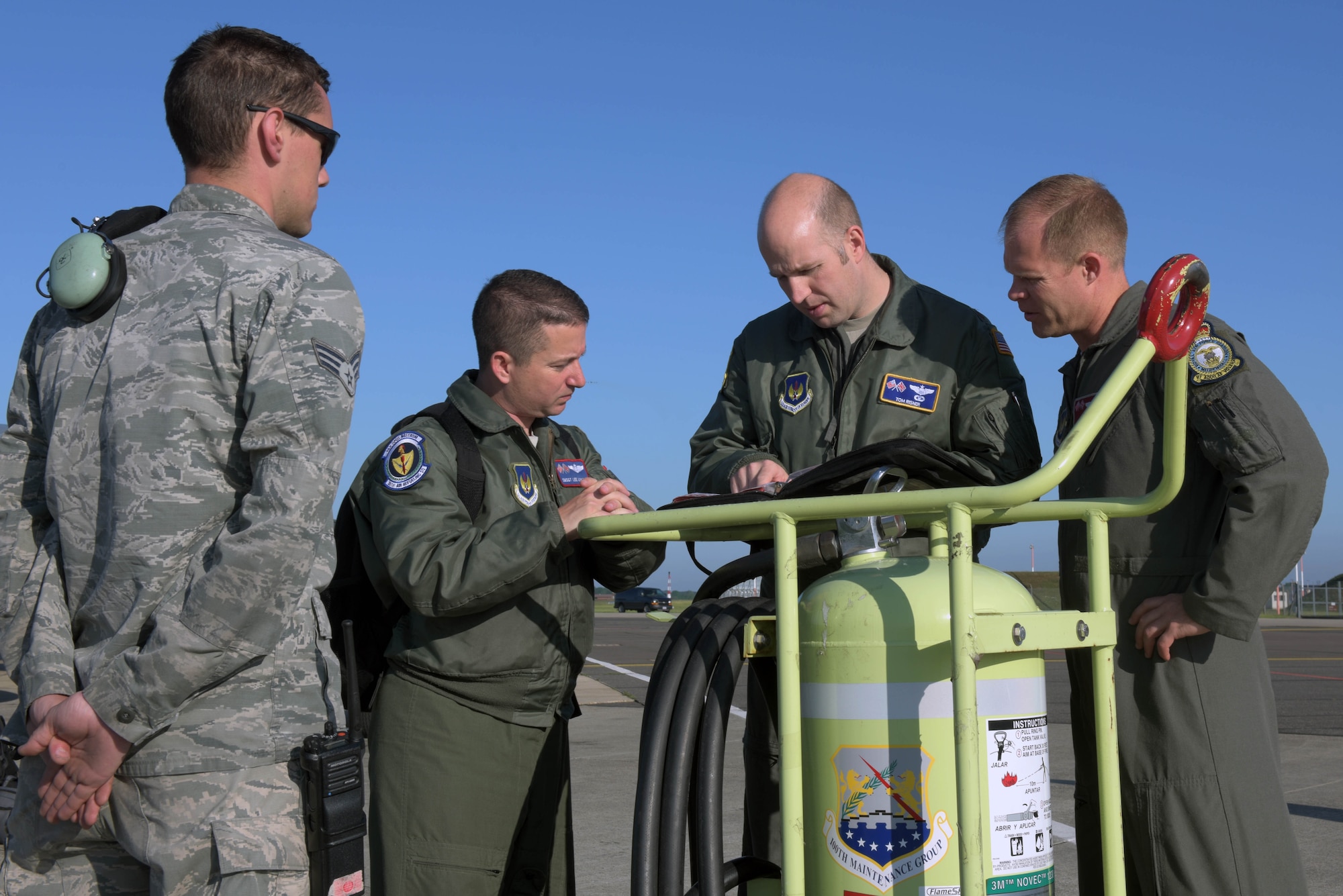 Airmen assigned to the 100th Air Refueling Wing, RAF Mildenhall, England, go over a pre-flight checklist prior to a refueling mission in support of the 75th anniversary commemoration of D-Day, at RAF Mildenhall, June 6, 2019. As seen during World War II, no nation can confront combat operations alone – and U.S. European Command with its subordinate components remain engaged, postured and ready to respond to threats as they arise. (U.S. Air Force photo by Senior Airman Benjamin Cooper)