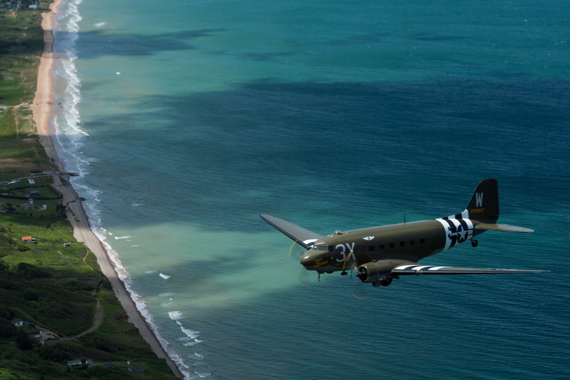 A Douglas C-47 Dakota, nicknamed “That’s All Brother,” flies over the beaches of Normandy, France, June 8, 2019. “That’s All Brother” dropped 101st Airborne troops during the invasion of Normandy, June 6, 1944. (U.S. Air Force photo by Senior Airman Devin M. Rumbaugh)