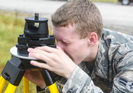 Airman 1st Class Weston Foust, an engineering assistant from the 20th Civil Engineer Squadron at Shaw Air Force Base, S.C., ensures a tripod is level while setting up global positioning receivers, June 5, 2019 at North Auxiliary Airfield, S.C. during an aircraft crash analysis exercise. Joint Base Charleston engineering assistants were joined by their counterparts from Shaw Air Force Base to help younger Airmen learn what it’s like to coordinate with other bases during a real world crisis scenario. Engineering assistants specialize in planning and managing construction projects for military installations and ensuring that facilities and structures are able to operate at full capacity.