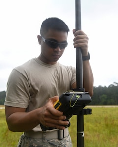 Airman 1st Class Jake Roxas, an engineering assistant assigned to the 628th Civil Engineer Squadron, uses a Trimble R8 Rover to plot the position of simulated aircraft wreckage, June 5, 2019 at North Auxiliary Airfield, S.C., during a crash assessment exercise. The exercise provided Airmen with the opportunity to practice on-seen protocols and to coordinate with other Airmen from Shaw Air Force Base, S.C., to completely map out debris in a simulated aircraft mishap. Air Force engineering assistants have the role of plotting out the positions of all debris pieces using global positioning devices during crash analysis operations. Engineering assistants specialize in planning and managing construction projects for bases and ensuring that facilities and structures are able to operate at full capacity.