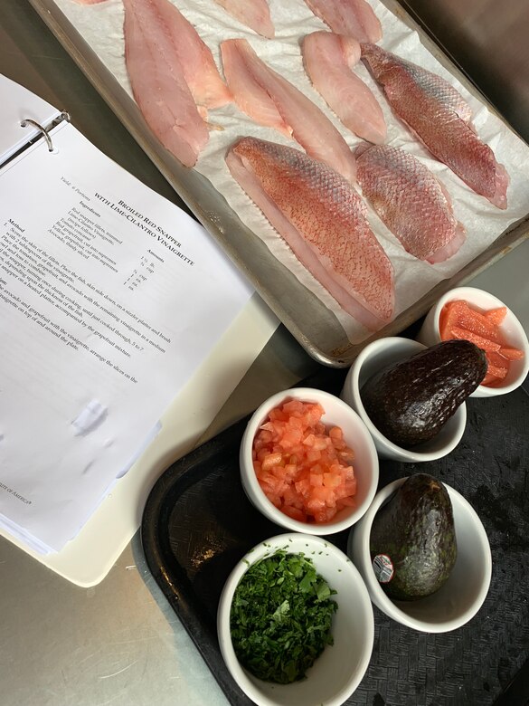 With ingredients prepped and the recipe handy, chef Gilbert Baboulene from Kadena Air Base, Japan, is ready to cook during the practical portion of the new Air Force Techniques of Healthy Cooking Course at the CIA San Antonio campus, June 5, 2019.  Sixteen nonappropriated fund food and beverage chefs and cooks from across the Air Force attended the course established by the Air Force Services Center, in partnership with the Culinary Institute of America San Antonio.  The five-day course is designed to teach and demonstrate healthier ingredients, flavorful spicing and better cooking methods to deliver healthier menu choices at food service operations across installations, not just at dining facilities. (U.S. Air Force photo by Debbie Aragon)