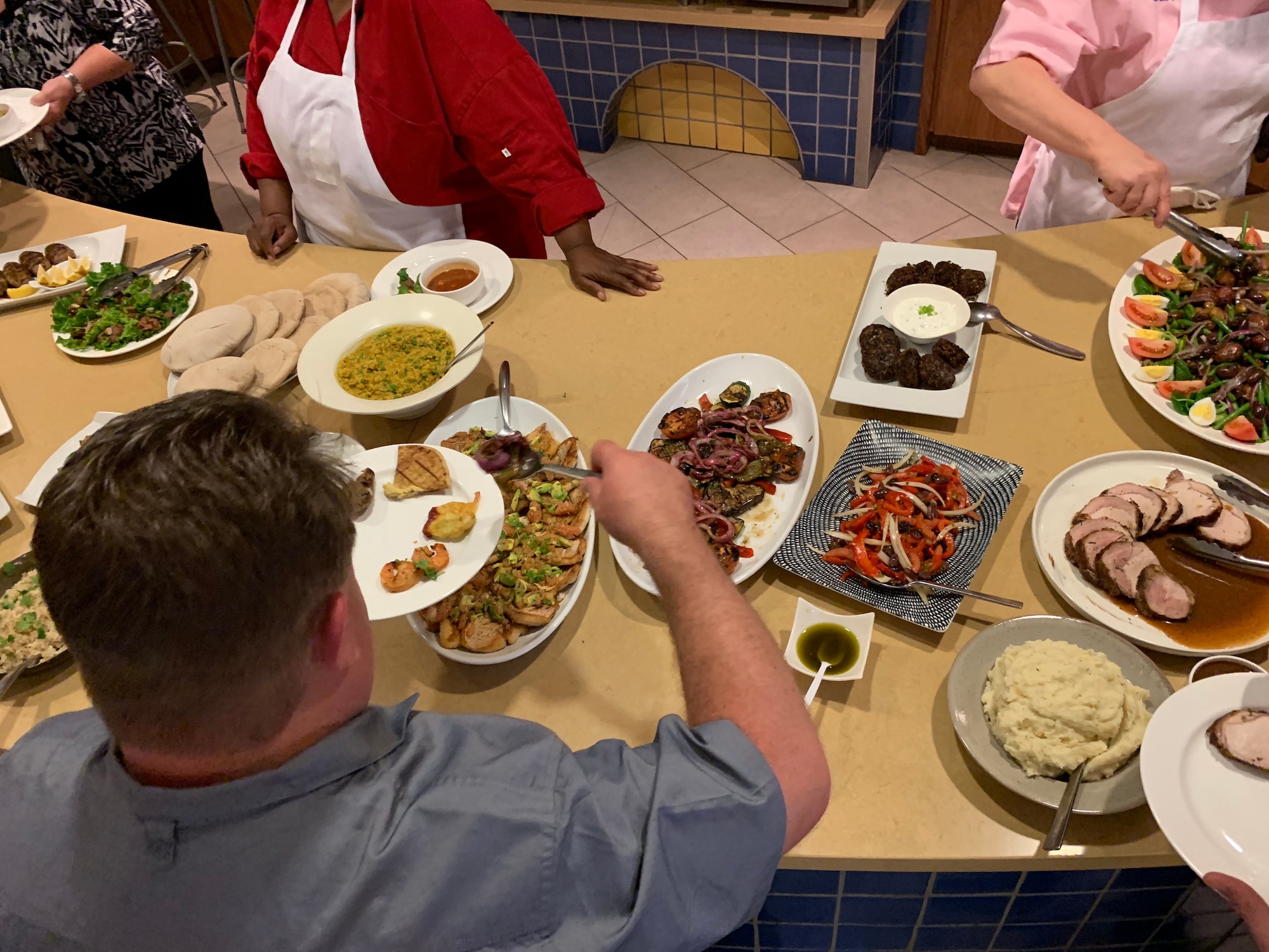 Students dig in to try dishes created by their class mates during the practical portion of the first Air Force Techniques of Healthy Cooking Course June 5, 2019, at the Culinary Institute of America's San Antonio campus. Sixteen nonappropriated fund chefs and cooks from across the Air Force attended the course established by the Air Force Services Center, in partnership with the CIA San Antonio.  The five-day course is designed to teach and demonstrate healthier ingredients, flavorful spicing and better cooking methods to deliver healthier menu choices at food service operations across installations, not just at dining facilities. (U.S. Air Force photo by Debbie Aragon)