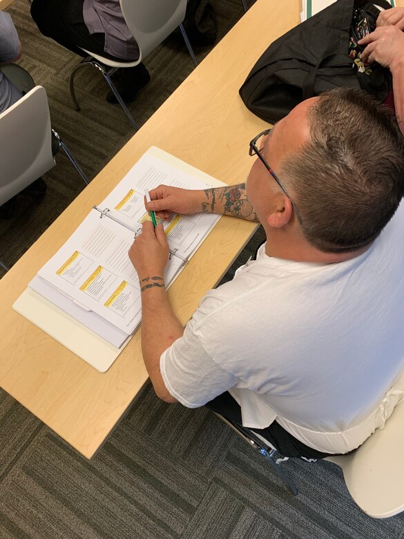 Gary DiMartino, a cook at Hanscom Air Force Base, Massachusetts, listens to a presentation by a Culinary Institute of America chef on the benefits of protein in the human body. Sixteen NAF chefs and cooks from across the Air Force attended the course established by the Air Force Services Center, in partnership with the CIA San Antonio.  The five-day course is designed to teach and demonstrate healthier ingredients, flavorful spicing and better cooking methods to deliver healthier menu choices at food service operations across installations, not just at dining facilities. (U.S. Air Force photo by Debbie Aragon)