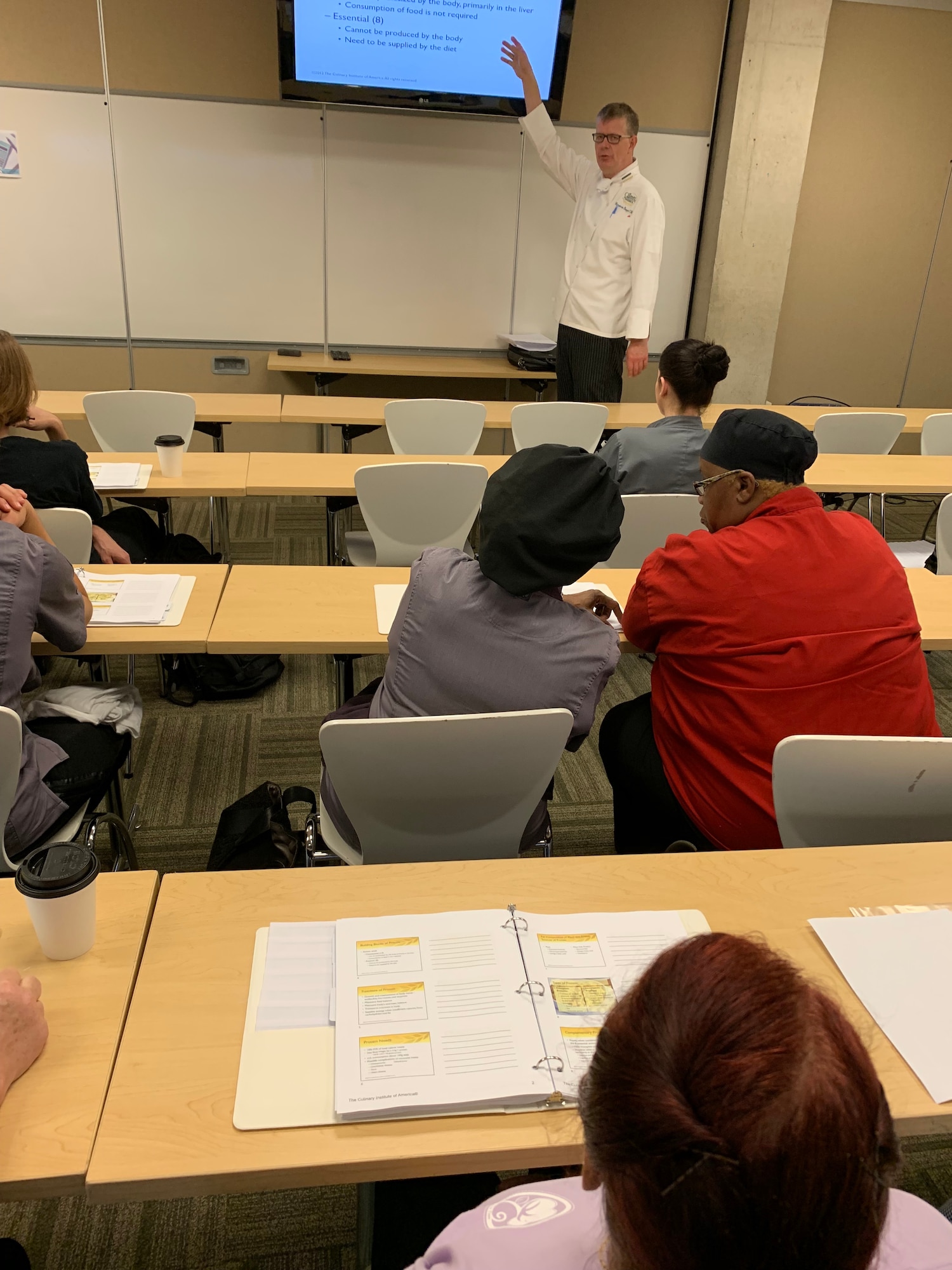 Culinary Institute of America Chef Hinnerk von Bargen talks to students about the nutrients the body needs during the first Air Force Techniques of Healthy Cooking Class for nonappropriated fund chefs and cooks at the CIA San Antonio Campus June 5, 2019.  Sixteen NAF employees from across the Air Force attended the course established by the Air Force Services Center, in partnership with the CIA San Antonio.  The five-day course is designed to teach and demonstrate healthier ingredients, flavorful spicing and better cooking methods to deliver healthier menu choices at food service operations across installations, not just at dining facilities. (U.S. Air Force photo by Debbie Aragon)