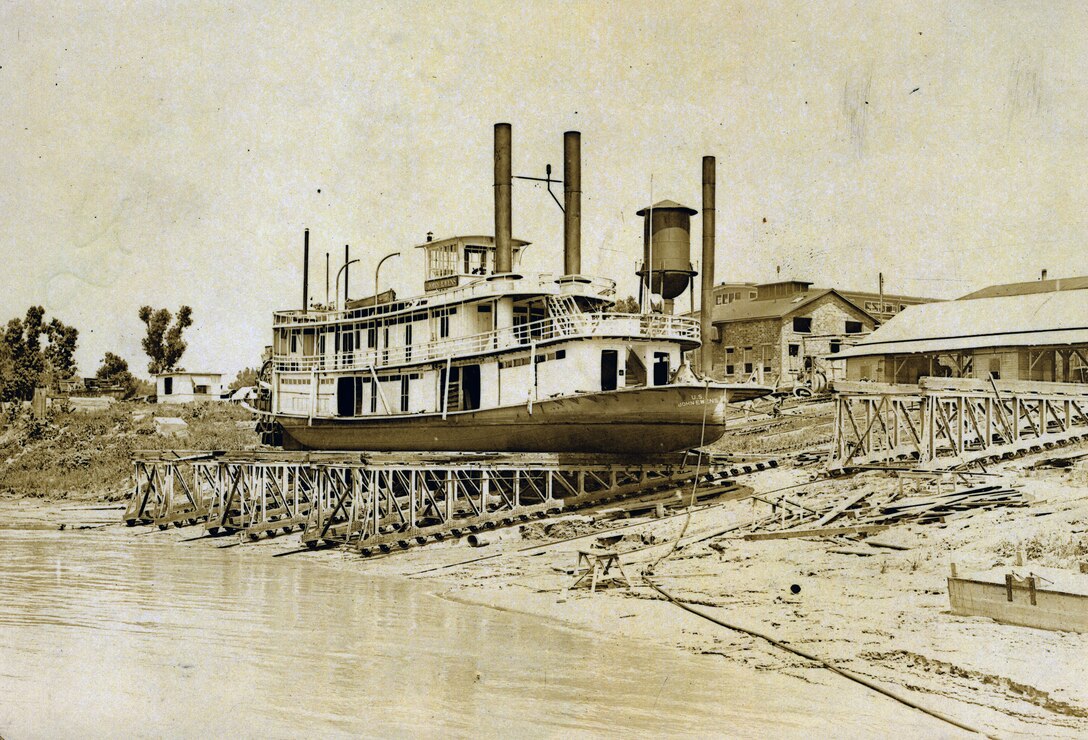 steamer on stilts on river shore