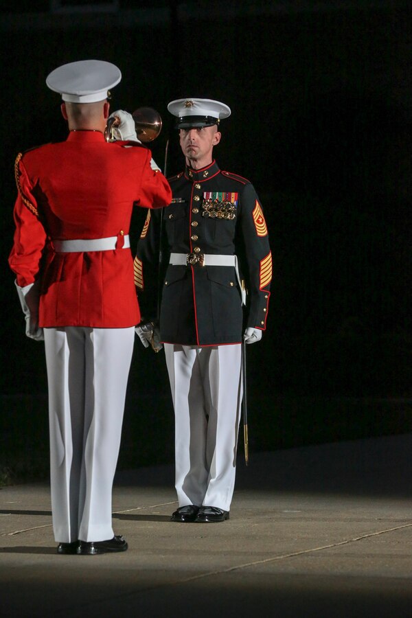 Sergeant Maj. Adrian L. Tagliere, battalion sergeant major, Marine Barracks Washington D.C., and LCpl. Teal Ewer, ceremonial bugler, “The Commandant’s Own,” U.S. Marine Drum and Bugle Corps perform during a Friday Evening Parade at the Barracks, June 07, 2019. The hosting official for the evening was Lt. Gen. Michael Dana, the director of Marine Corps Staff, and the guest of honor was Ms. Cora Storbeck, the president of the Hallmark Corporate Foundation and director of Community Involvement at Hallmark. (U.S. Marine Corps photo by Pfc. Allen Sanders)