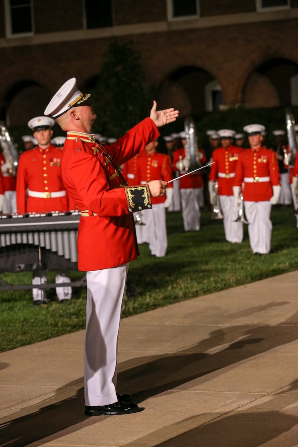 Major James Foley, commanding officer, “The Commandant’s Own,” U.S. Marine Drum and Bugle Corps, directs the D&B during a Friday Evening Parade at Marine Barracks Washington, D.C., June 07, 2019. The hosting official for the evening was Lt. Gen. Michael Dana, the director of Marine Corps Staff, and the guest of honor was Ms. Cora Storbeck, the president of the Hallmark Corporate Foundation and director of Community Involvement at Hallmark. (U.S. Marine Corps photo by Pfc. Allen Sanders)