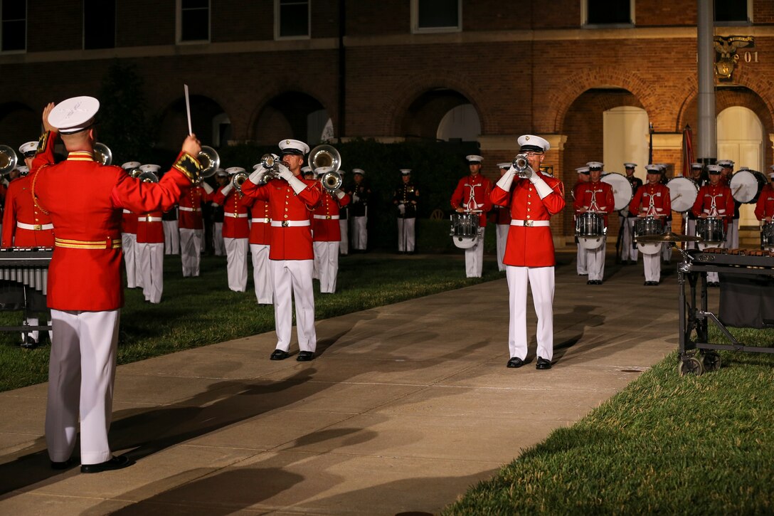 Marines with “The Commandant’s Own” U.S. Marine Drum and Bugle Corps perform a musical ballad during a Friday Evening Parade at Marine Barracks Washington, D.C., June 07, 2019. The hosting official for the evening was Lt. Gen. Michael Dana, the director of Marine Corps Staff, and the guest of honor was Ms. Cora Storbeck, the president of the Hallmark Corporate Foundation and director of Community Involvement at Hallmark. (U.S. Marine Corps photo by Pfc. Allen Sanders)