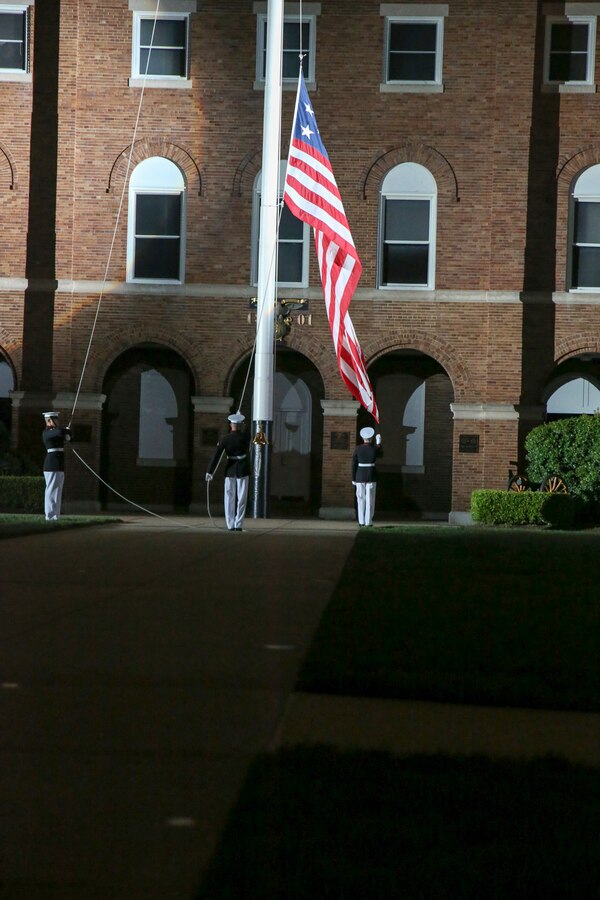 Marines with Marine Barracks Washington D.C. perform evening colors during a Friday Evening Parade at the Barracks, June 07, 2019. The hosting official for the evening was Lt. Gen. Michael Dana, the director of Marine Corps Staff, and the guest of honor was Ms. Cora Storbeck, the president of the Hallmark Corporate Foundation and director of Community Involvement at Hallmark. (U.S. Marine Corps photo by Pfc. Allen Sanders)