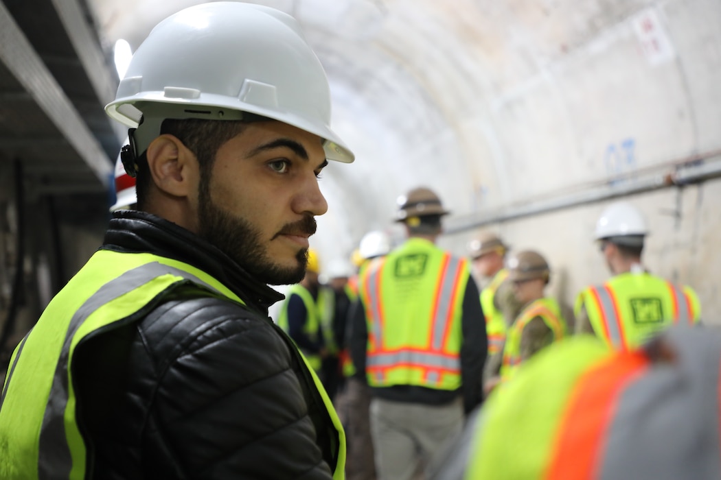 Iraq Computer Engineer Abdulrahman Alnuiami inside the grout tunnel at Mosul Dam. Alnuiami monitors the Automated Data Acquisition System that permits remote 24/7 instrumentation monitoring of the dam, using more than 800 devices installed onsite that gage water elevations, ground water pressures, water quality and flow rates, and surface displacement.