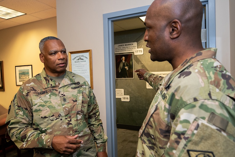 Command Sgt. Maj. John Sampa, 12th Command Sergeant Major of the Army National Guard, left, and Command Sgt. Maj. Courtney Ross, U.S. Army Financial Management Command command sergeant major have a discussion at the Maj. Gen. Emmett J. Bean Federal Center in Indianapolis June 6, 2019. During his visit, Sampa also met with Maj. Gen. David C. Coburn, USAFMCOM commanding general, and William Staley, USAFMCOM deputy to the commanding general, to discuss building stronger partnerships between Regular Army and National Guard financial management Soldiers. (U.S. Army photo by Mark R. W. Orders-Woempner)