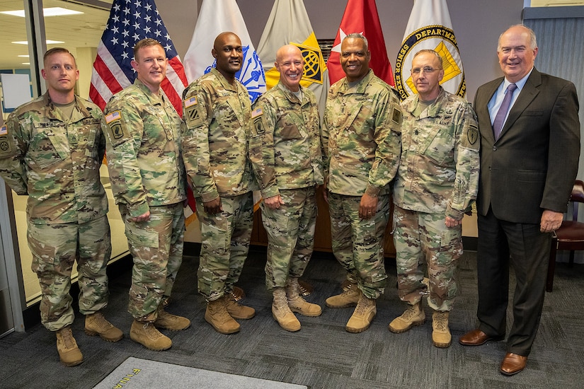 Command Sgt. Maj. John Sampa, 12th Command Sergeant Major of the Army National Guard, center right, poses for a group photo during his visit to the U.S. Army Financial Management Command headquarters at the Maj. Gen. Emmett J. Bean Federal Center in Indianapolis June 6, 2019. During his visit, Sampa met with Maj. Gen. David C. Coburn, USAFMCOM commanding general, center; William Staley, USAFMCOM deputy to the commanding general, far right; and Command Sgt. Maj. Courtney Ross, USAFMCOM command sergeant major, center left, to discuss building stronger partnerships between Regular Army and National Guard financial management Soldiers. (U.S. Army photo by Mark R. W. Orders-Woempner)